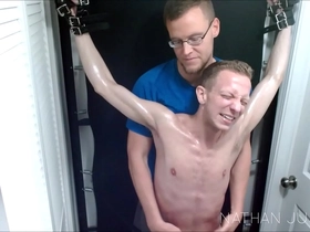 Male Model Landon's Tickle Punishment on The Metal Frame By Nathan Justice